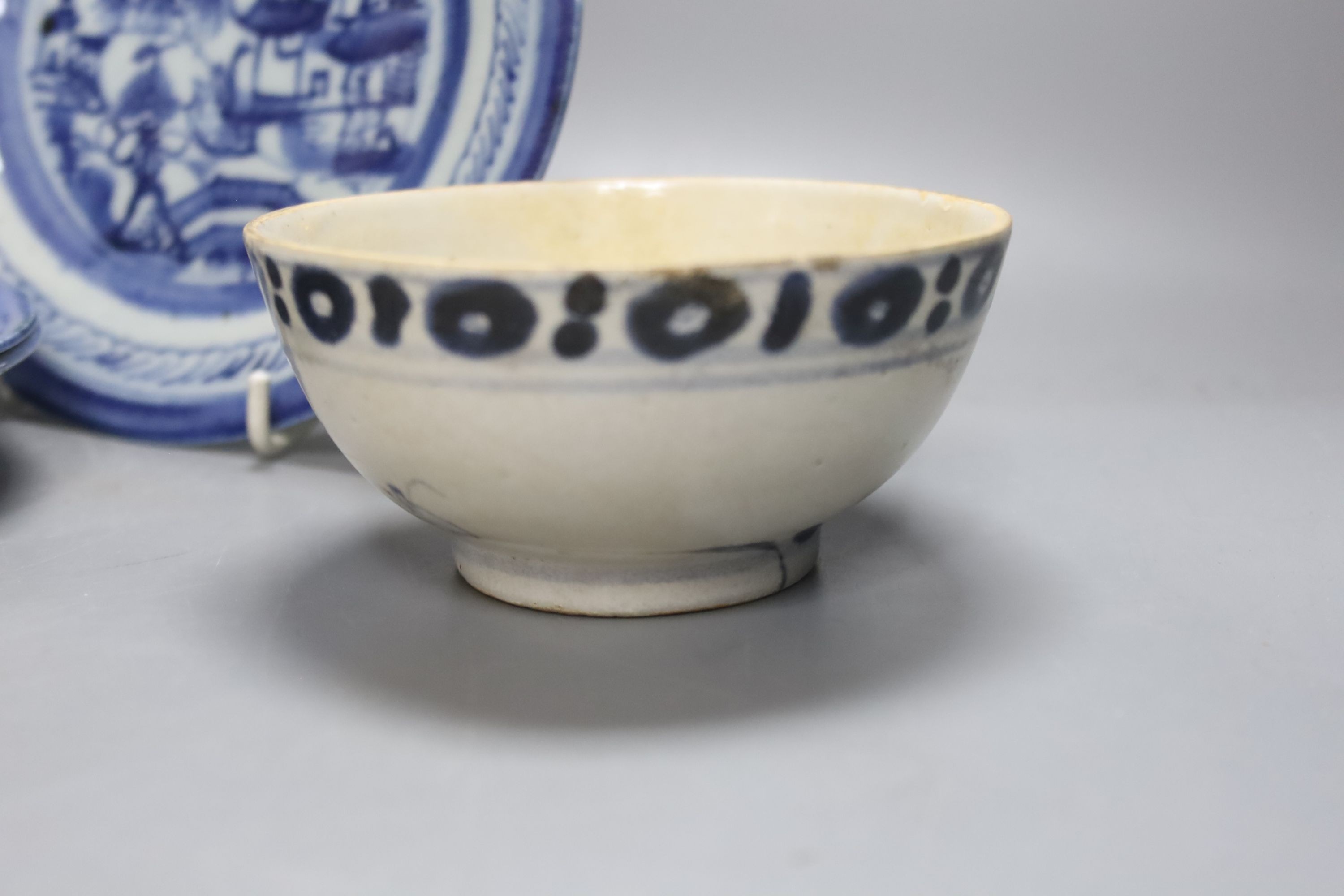 Four 19th century Chinese blue and white plates and two bowls, plates 15 cms diameter.